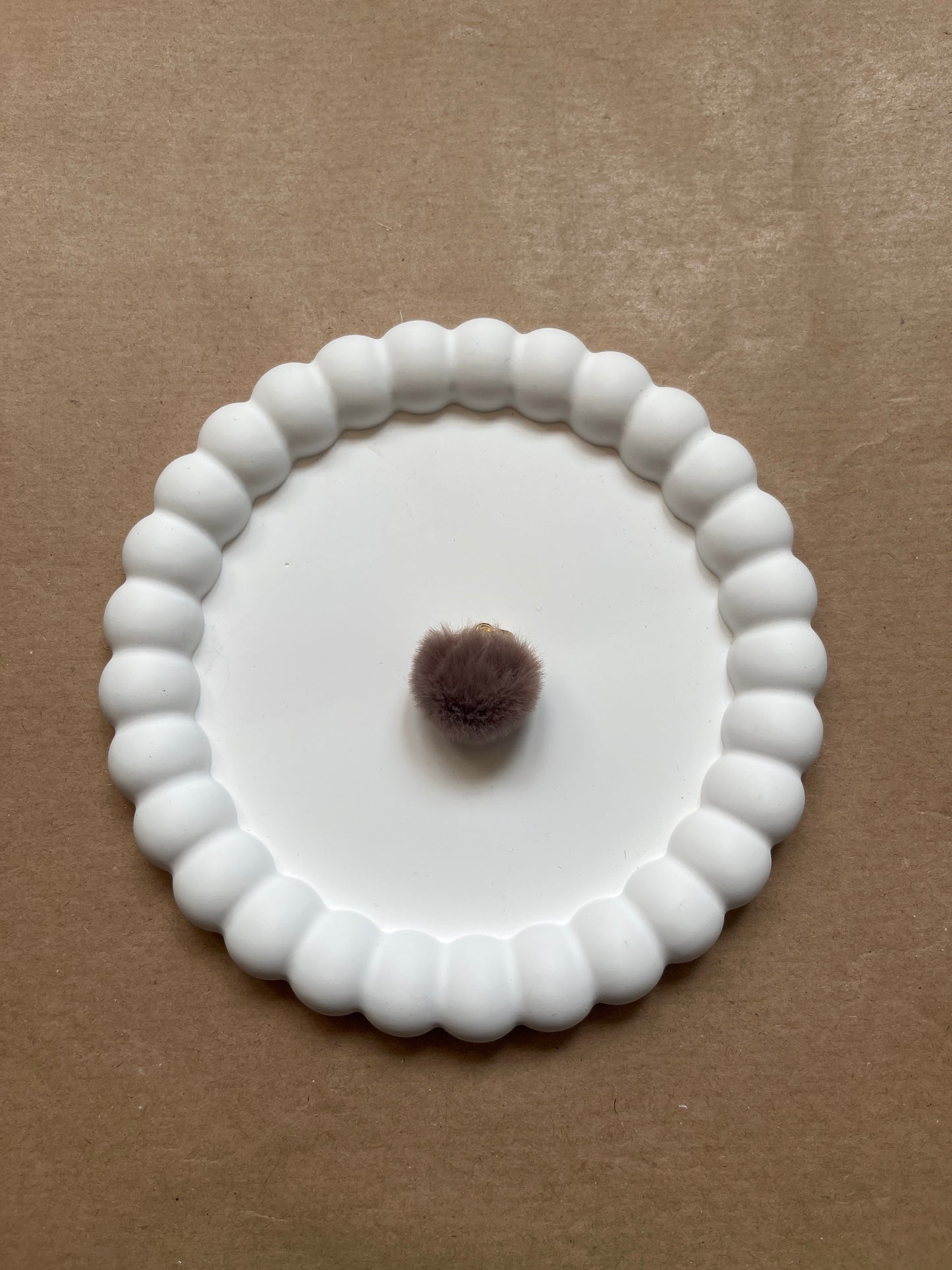 Brown pompom