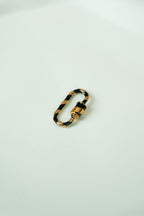 The carabiner ring with lock system (black and gold)