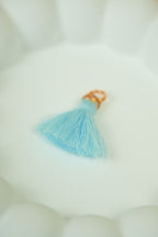 Light blue tassel (gold)