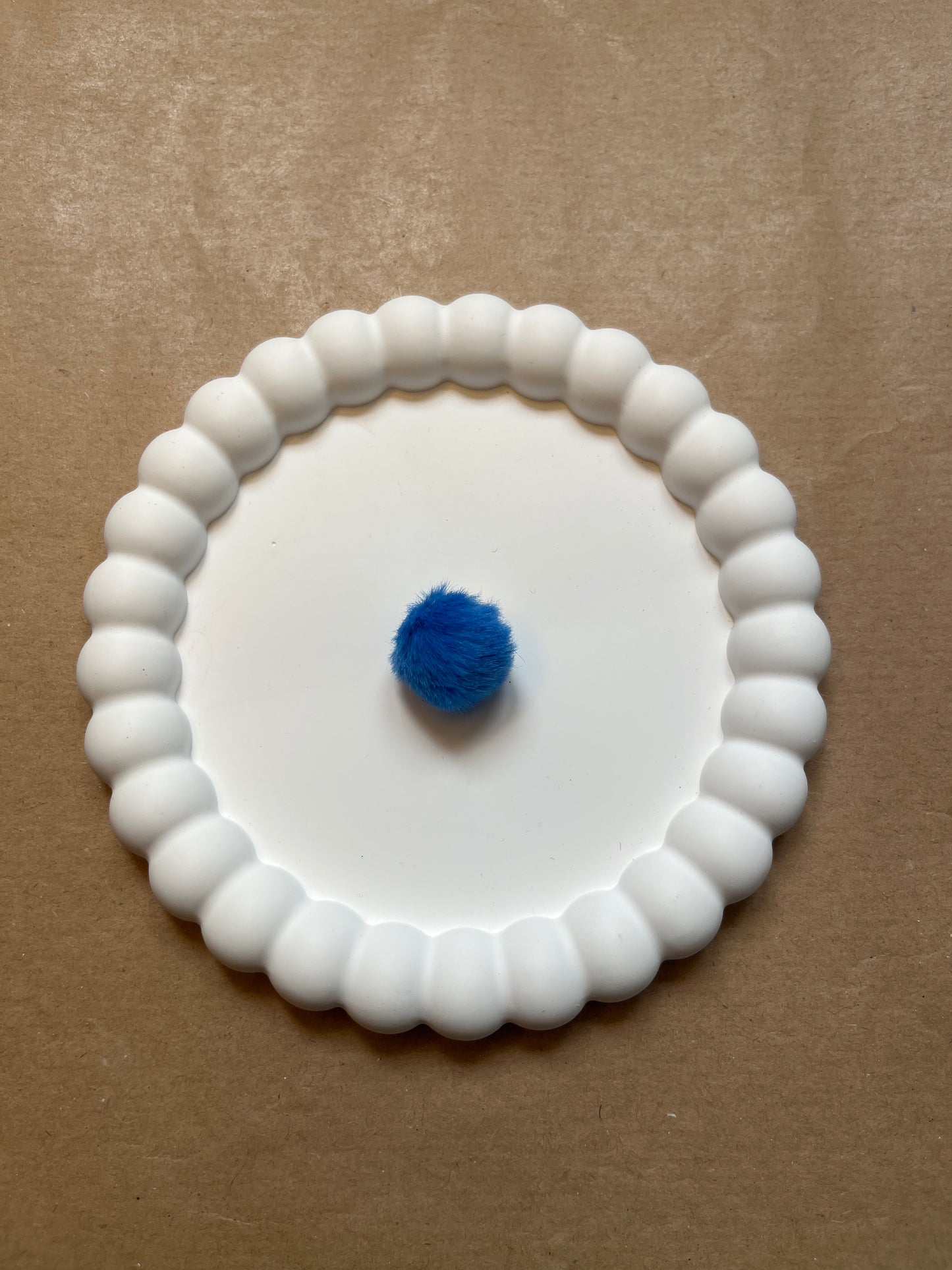 Dark blue pompom